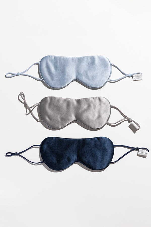Three Cozy Silk Eye Masks in blue, gray, and navy, made with Soft Light® mulberry silk fabric.