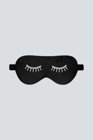 Black MANITO Pearlwear Silk Eye Mask with sparkling crystal eyelash detail, crafted for light-free restful sleep.